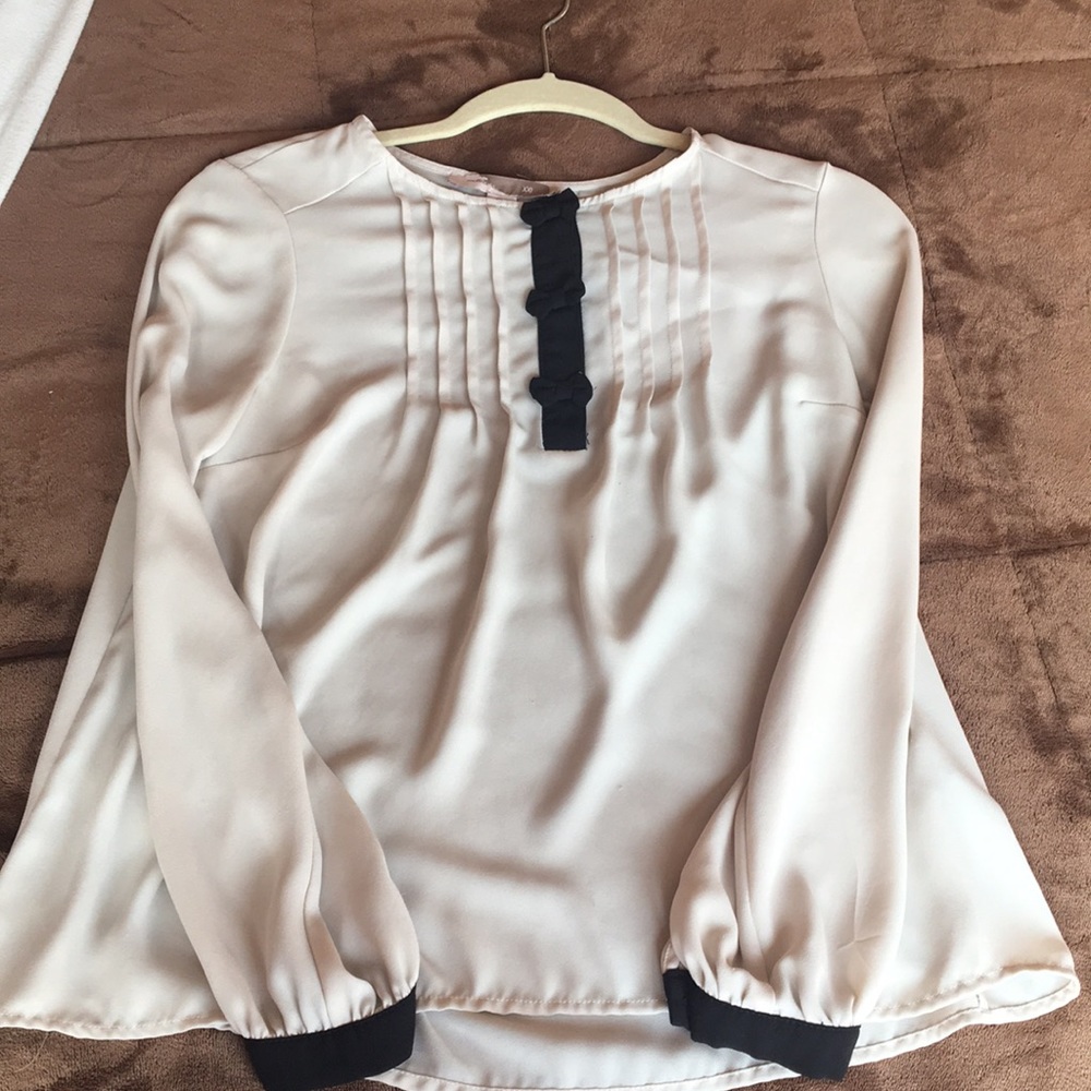 Thin cream and black blouse